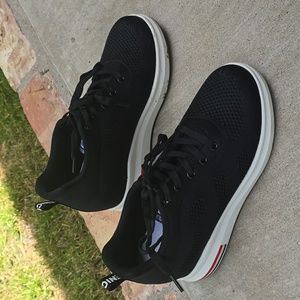 Women's sporty tennis shoes with 1 1/2 inch heel.